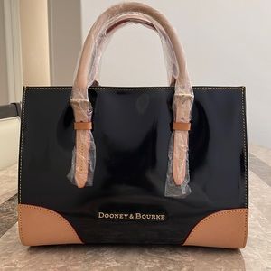 Dooney& Bourke New with tags Pattern leather bag ,black with brown trimming’s.
